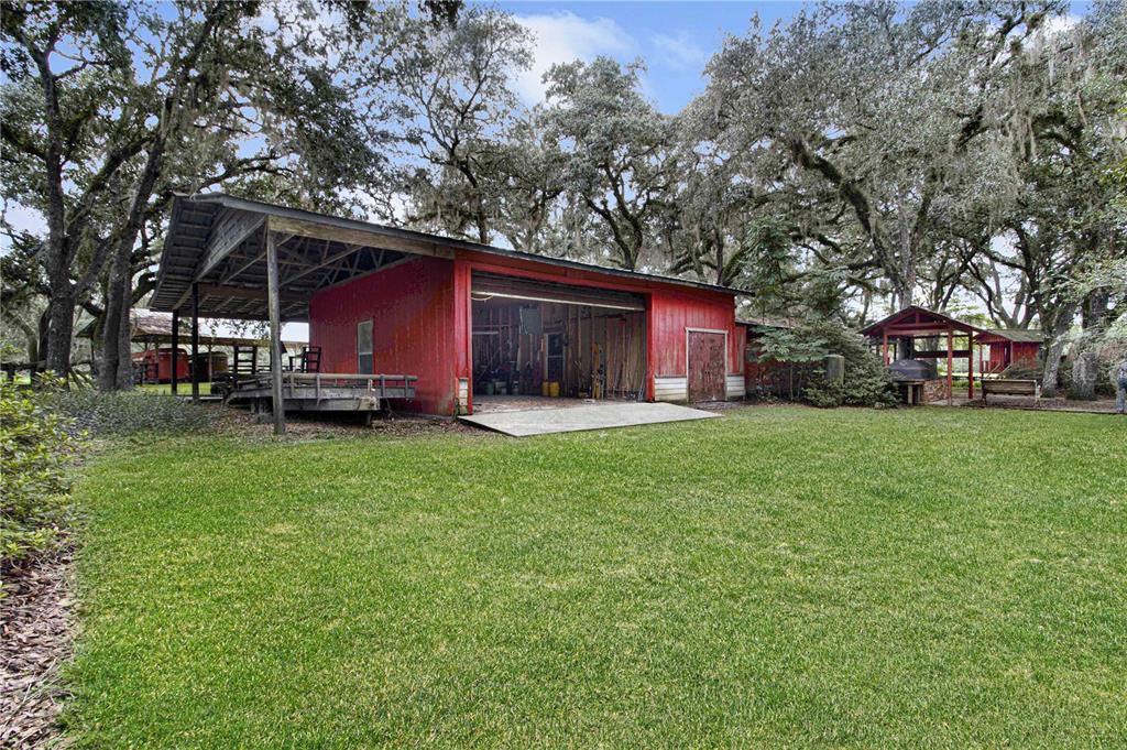 3350 Northeast 125th Terrace Road Silver Springs, FL 34488 - Photo 25 of 47 a view of a house with a yard