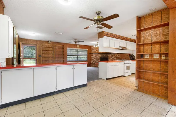 a kitchen with a cabinets and white appliances