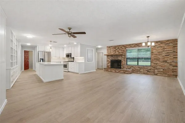 a view of a kitchen with furniture and a fireplace