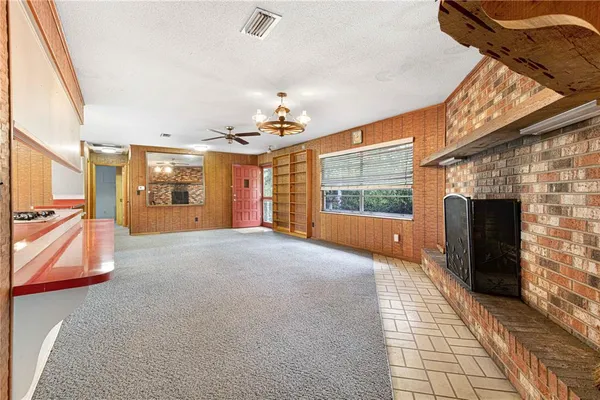a view of livingroom with furniture and a fireplace
