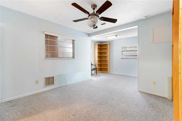 a view of an empty room with a window