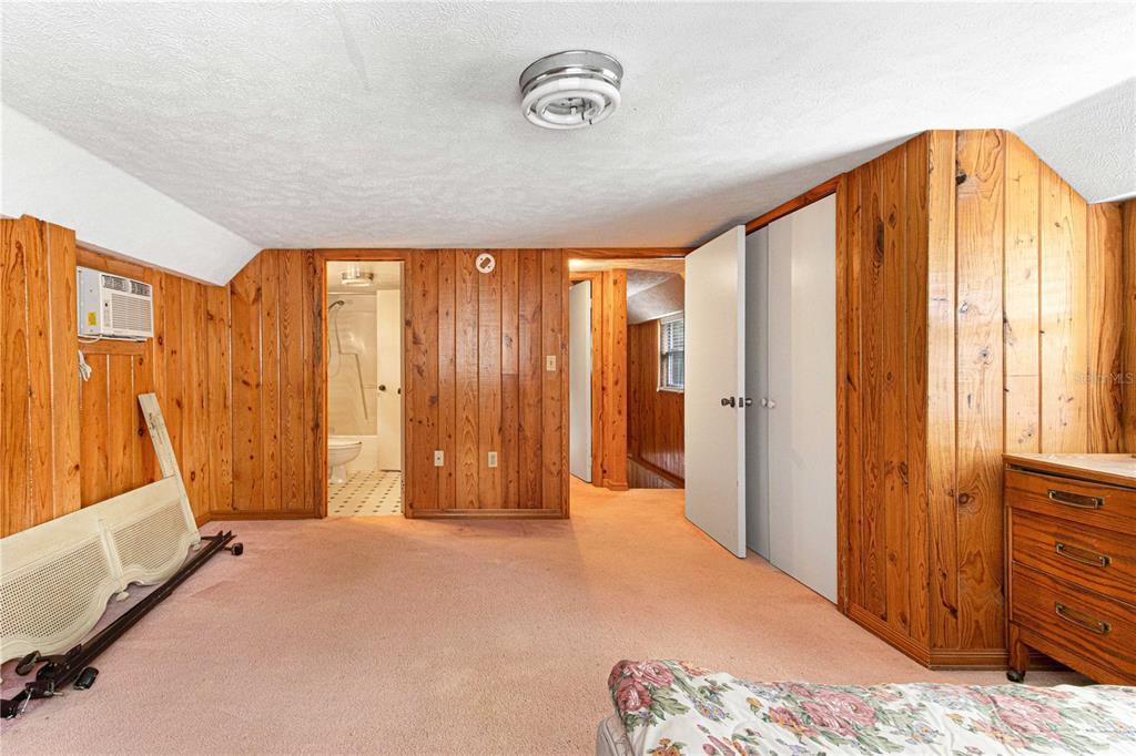 3350 Northeast 125th Terrace Road Silver Springs, FL 34488 - Photo 44 of 47 a bedroom with a bed and a window