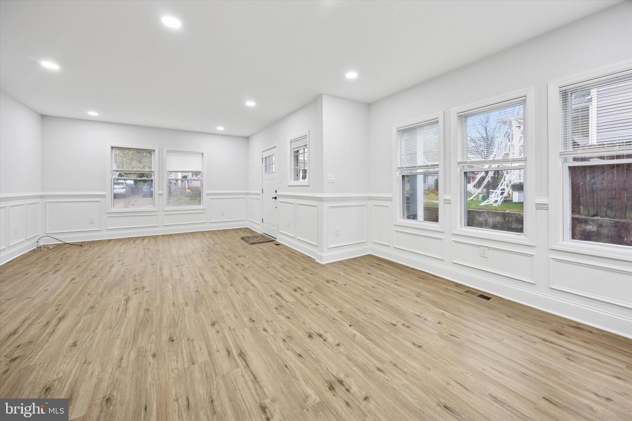 229 New Jersey Avenue, Unit B Collingswood, NJ 08108 - Photo 3 of 18 a large room with wooden floor and windows