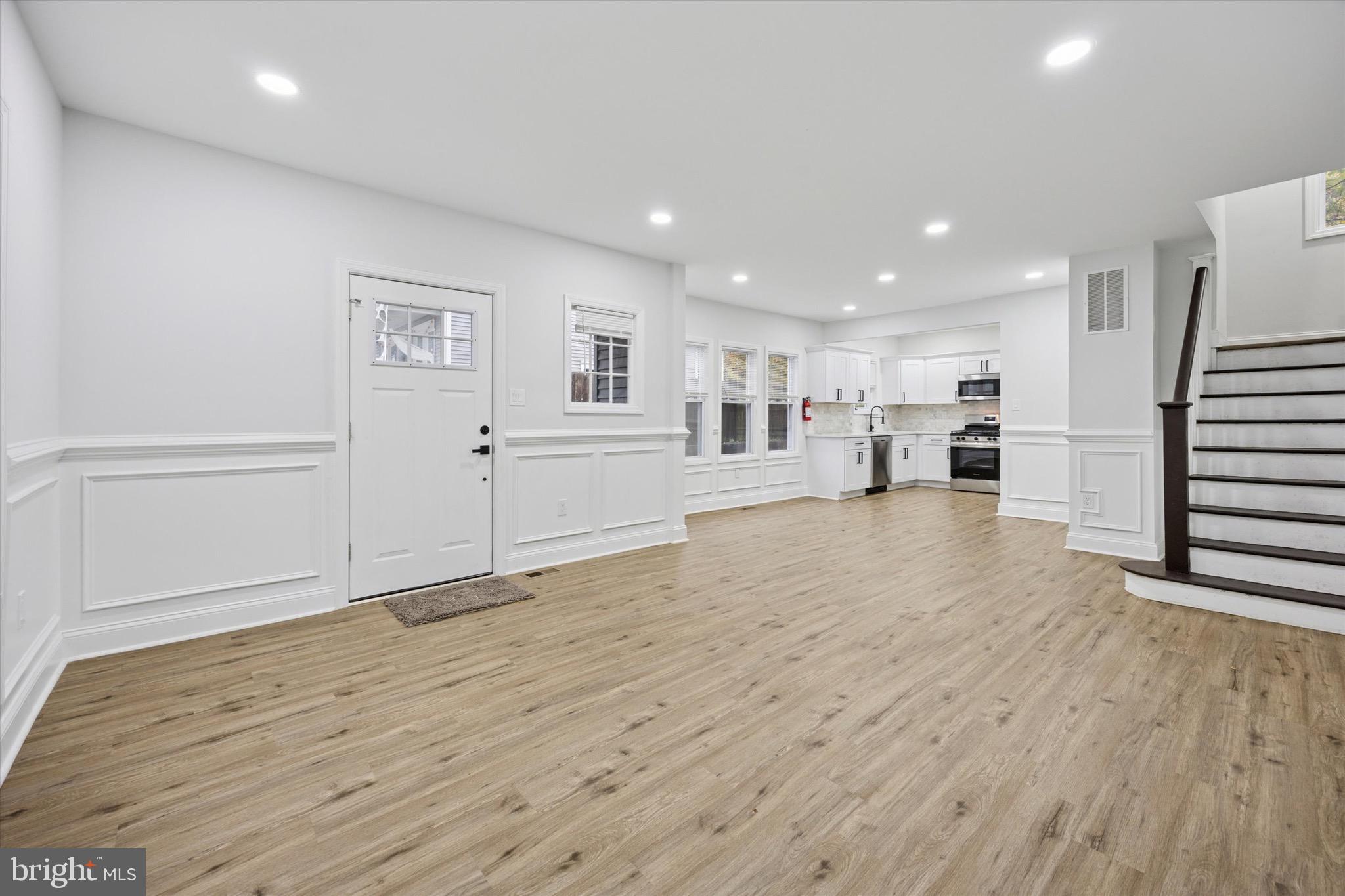 229 New Jersey Avenue, Unit B Collingswood, NJ 08108 - Photo 4 of 18 a view of a room with wooden floor and windows