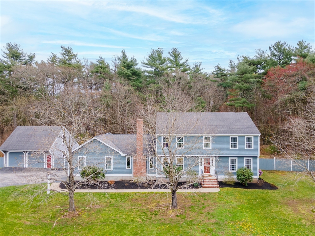 5 Strawberry Lane Norfolk, MA 02056 - Photo 1 of 42 a front view of a house with garden
