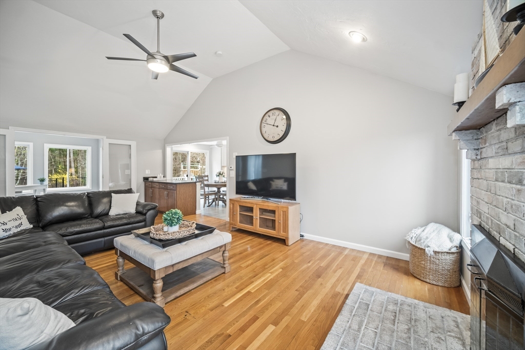 5 Strawberry Lane Norfolk, MA 02056 - Photo 12 of 42 a living room with furniture and a flat screen tv