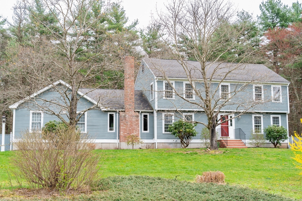 5 Strawberry Lane Norfolk, MA 02056 - Photo 2 of 42 a front view of a house with a garden and plants