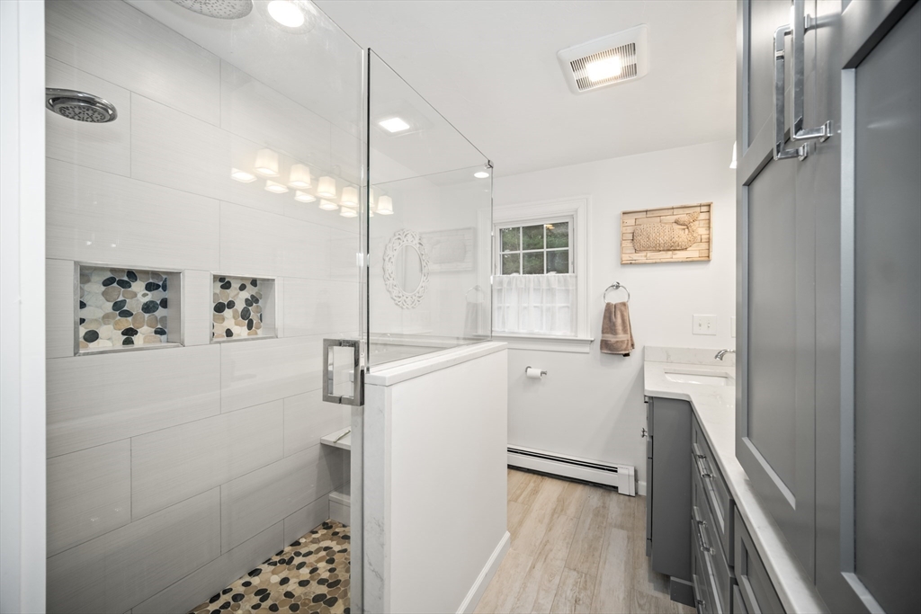 5 Strawberry Lane Norfolk, MA 02056 - Photo 21 of 42 a bathroom with a bathtub and a sink