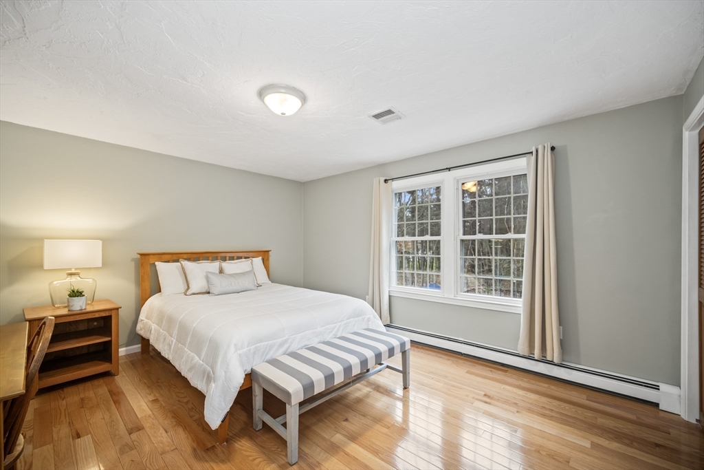 5 Strawberry Lane Norfolk, MA 02056 - Photo 25 of 42 a bedroom with a bed and a window