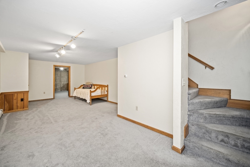 5 Strawberry Lane Norfolk, MA 02056 - Photo 26 of 42 a living room with furniture and a ceiling fan