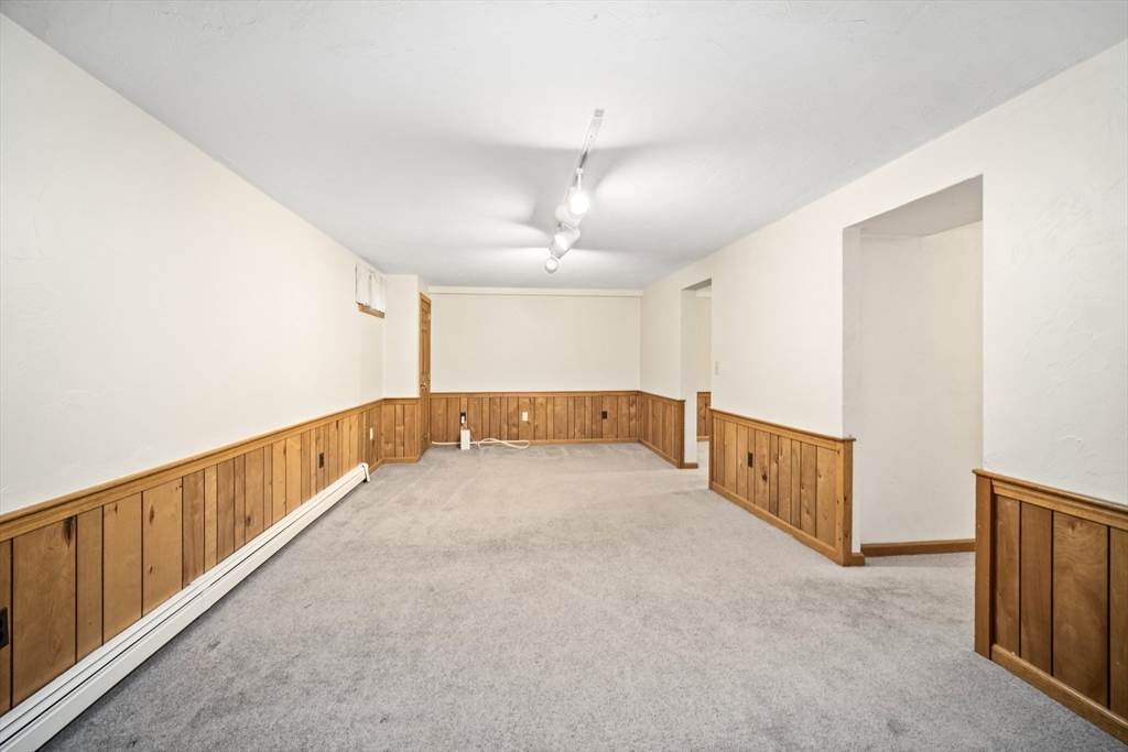 5 Strawberry Lane Norfolk, MA 02056 - Photo 27 of 42 a view of an empty room with windows