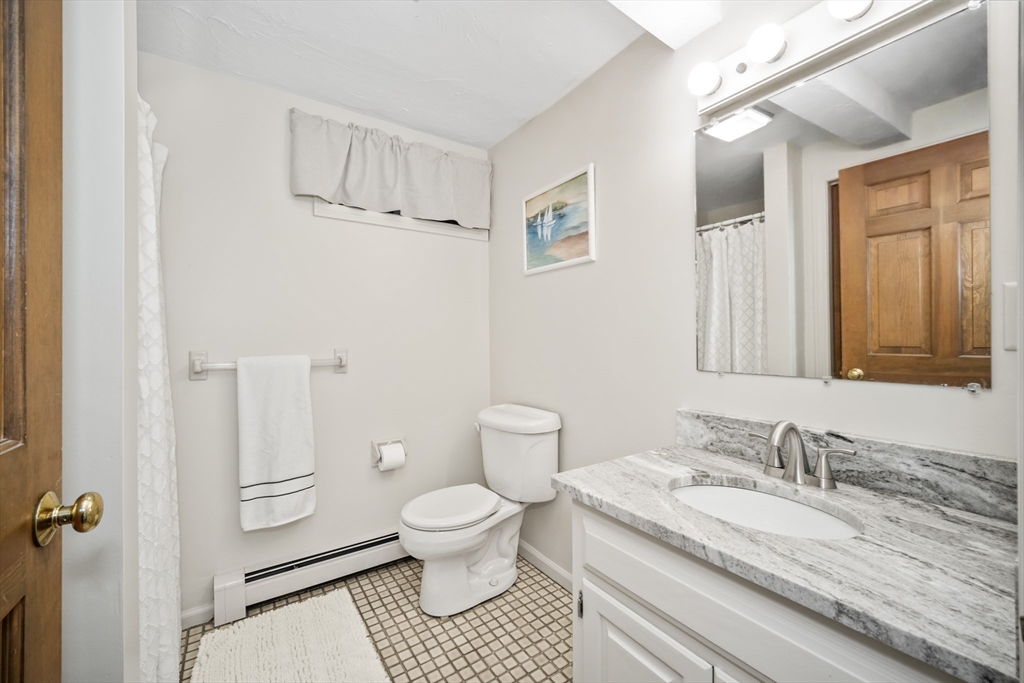 5 Strawberry Lane Norfolk, MA 02056 - Photo 29 of 42 a bathroom with a granite countertop sink toilet and shower