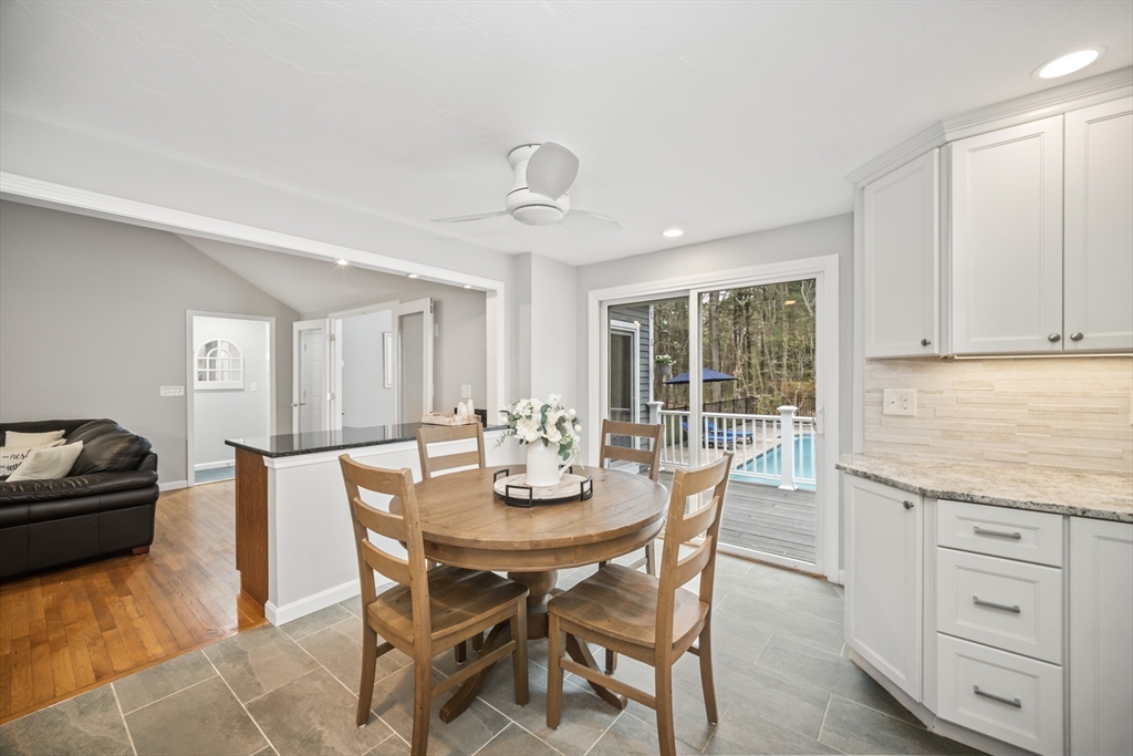 5 Strawberry Lane Norfolk, MA 02056 - Photo 9 of 42 a view of a dining room with furniture and wooden floor