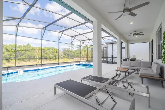 a palm tree sitting in front of a building with palm trees