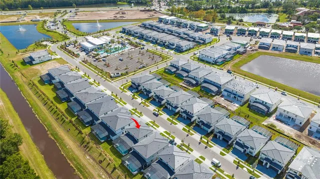 a view of a swimming pool with outdoor seating