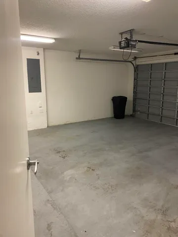 a view of staircase with wooden floor and white walls