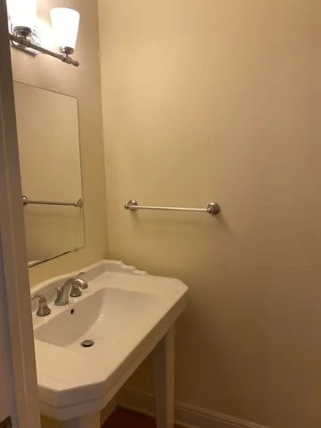 a bathroom with a sink and mirror