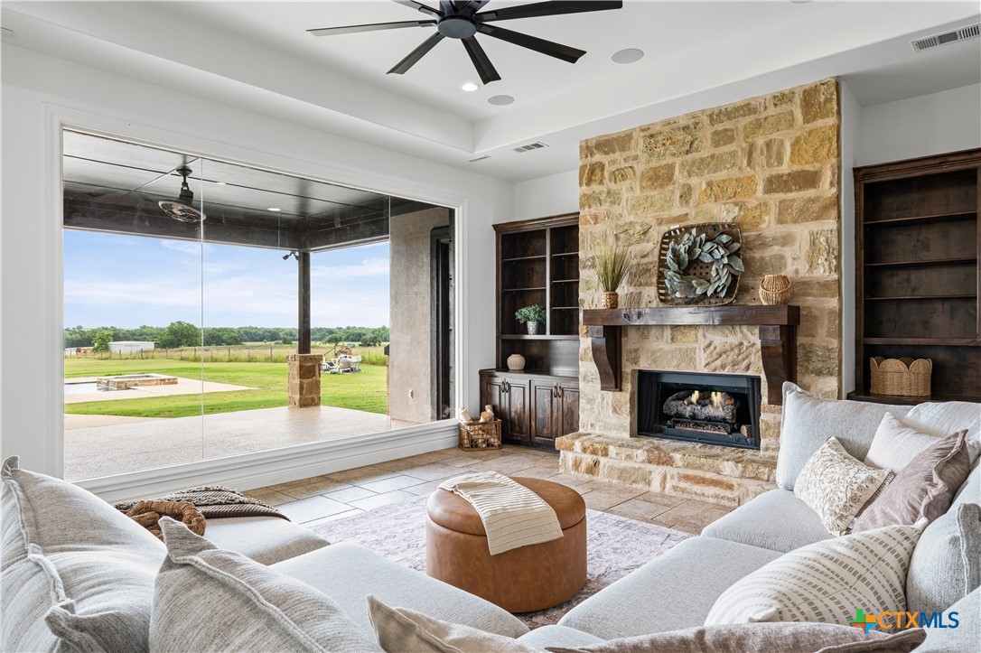 11023 Bigham Road Troy, TX 76579 - Photo 12 of 42 a living room with furniture and a fireplace