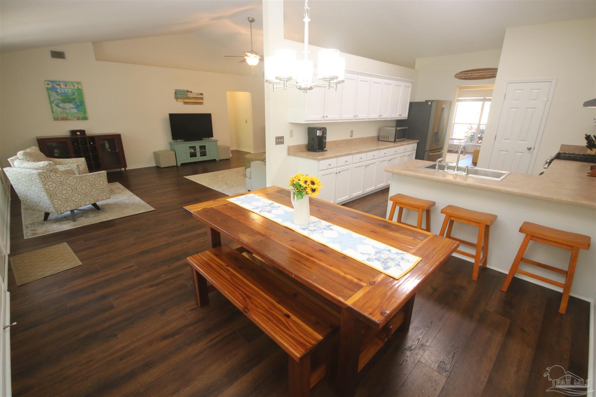4930 Chads Circle Milton, FL 32571 - Photo 11 of 50 a kitchen with sink table and chairs