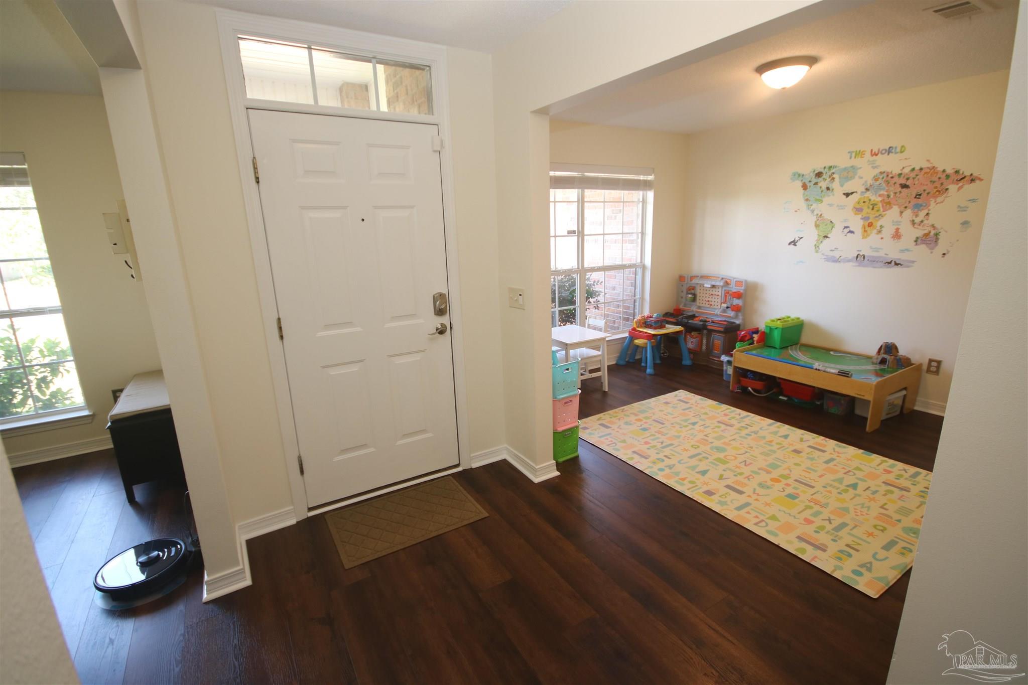4930 Chads Circle Milton, FL 32571 - Photo 23 of 50 a living room with furniture and a window