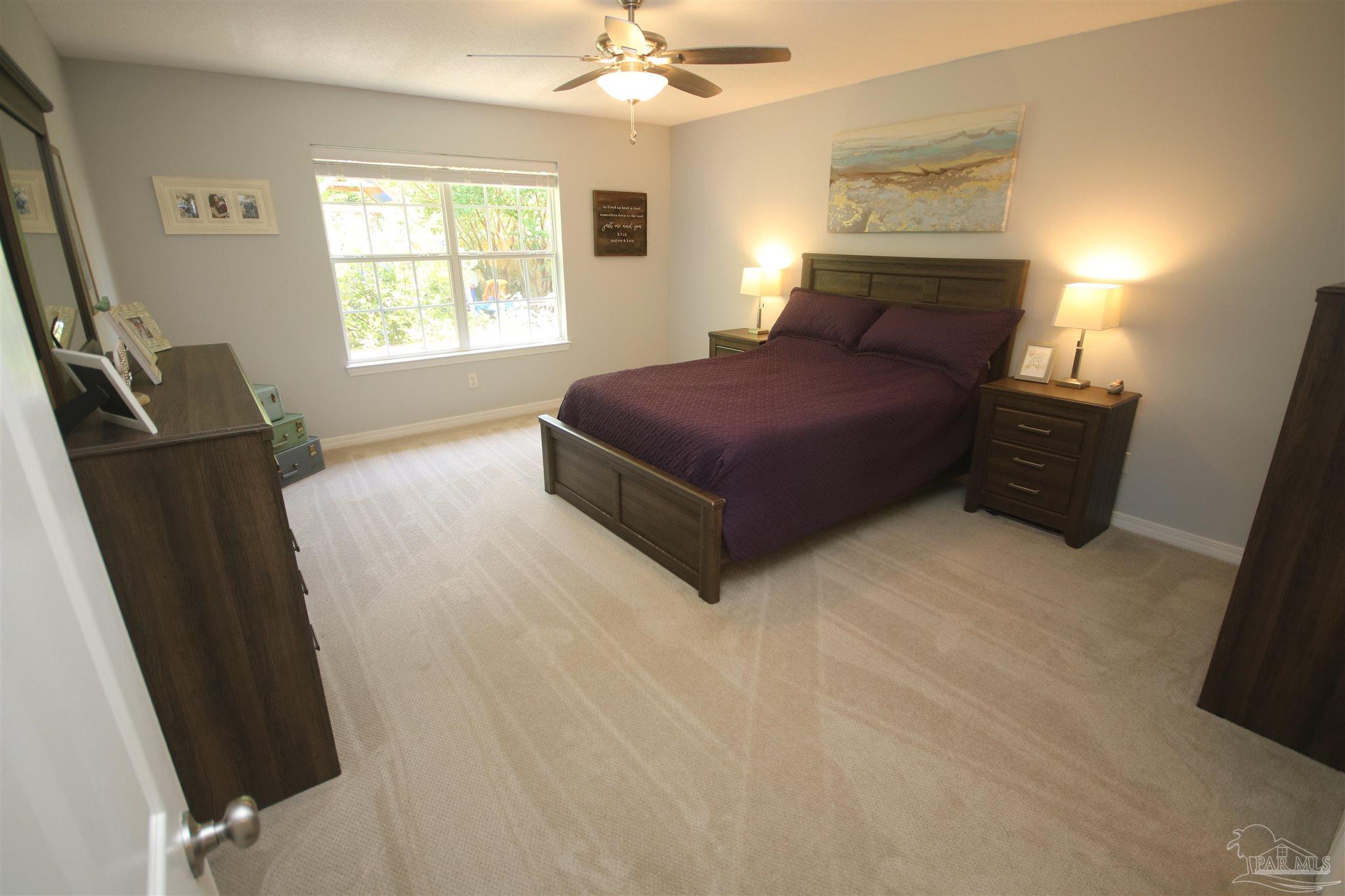 4930 Chads Circle Milton, FL 32571 - Photo 50 of 50 a bedroom with a bed dresser and a window