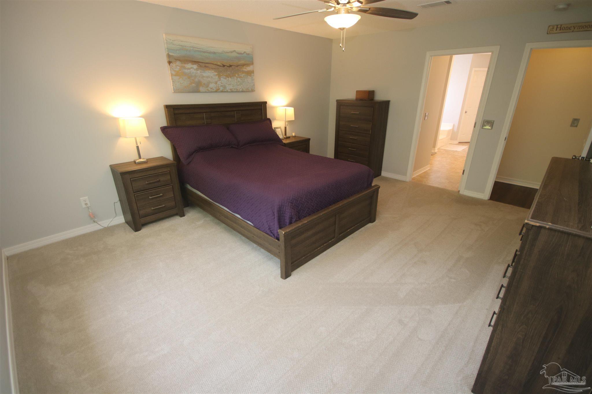 4930 Chads Circle Milton, FL 32571 - Photo 26 of 50 a bedroom with a bed dresser and a window