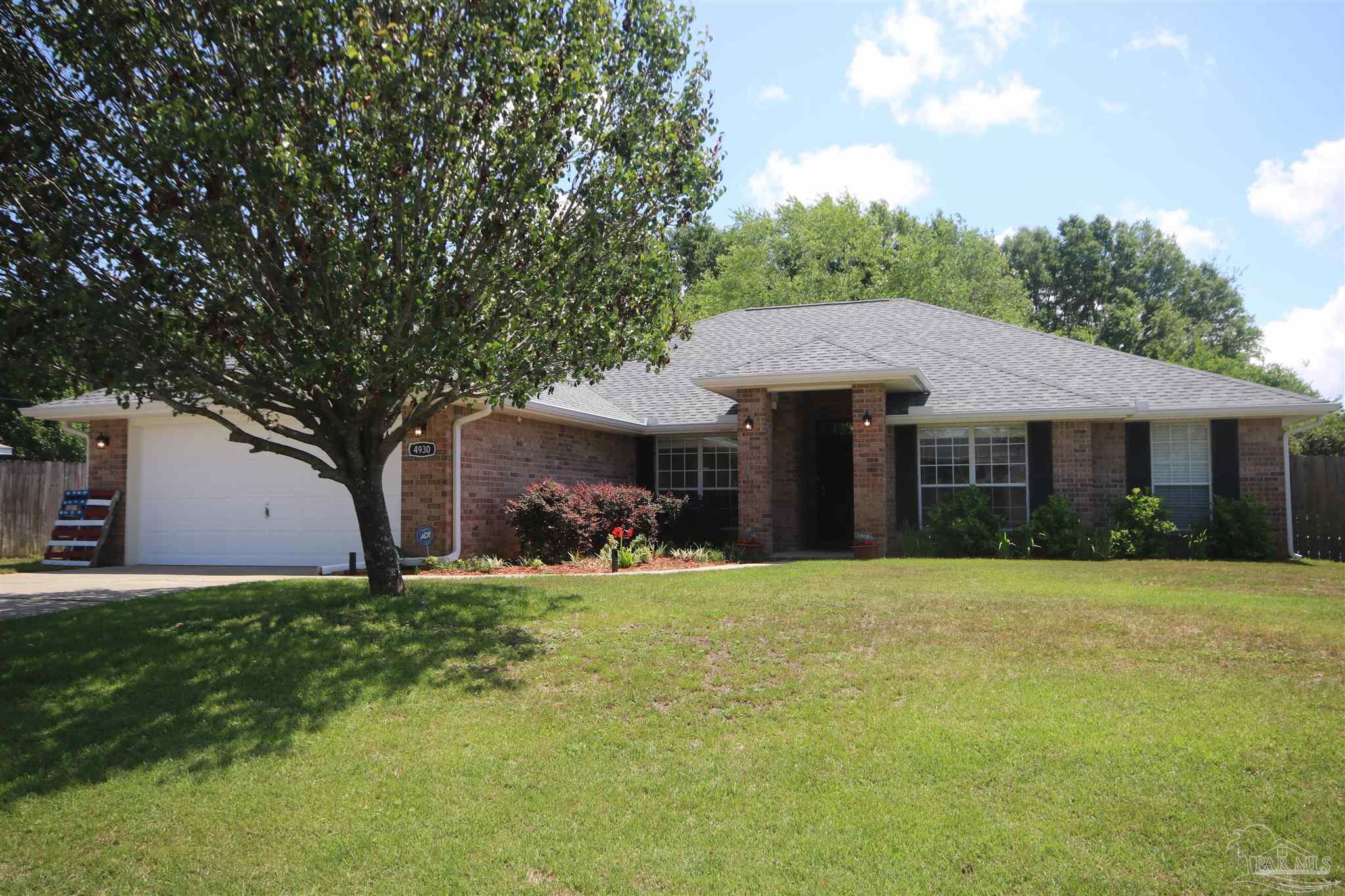4930 Chads Circle Milton, FL 32571 - Photo 3 of 50 a front view of a house with a yard