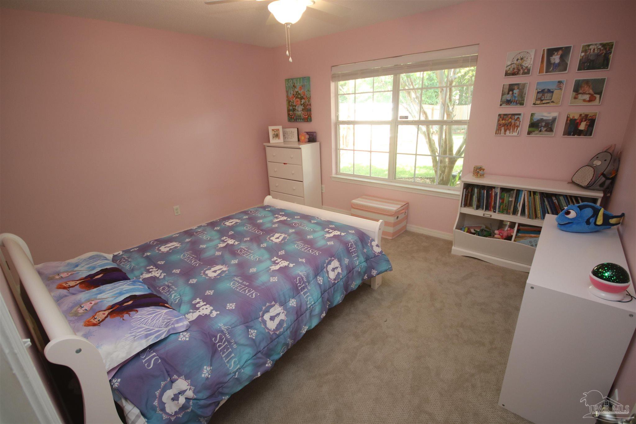 4930 Chads Circle Milton, FL 32571 - Photo 39 of 50 a bedroom with a bed and a window
