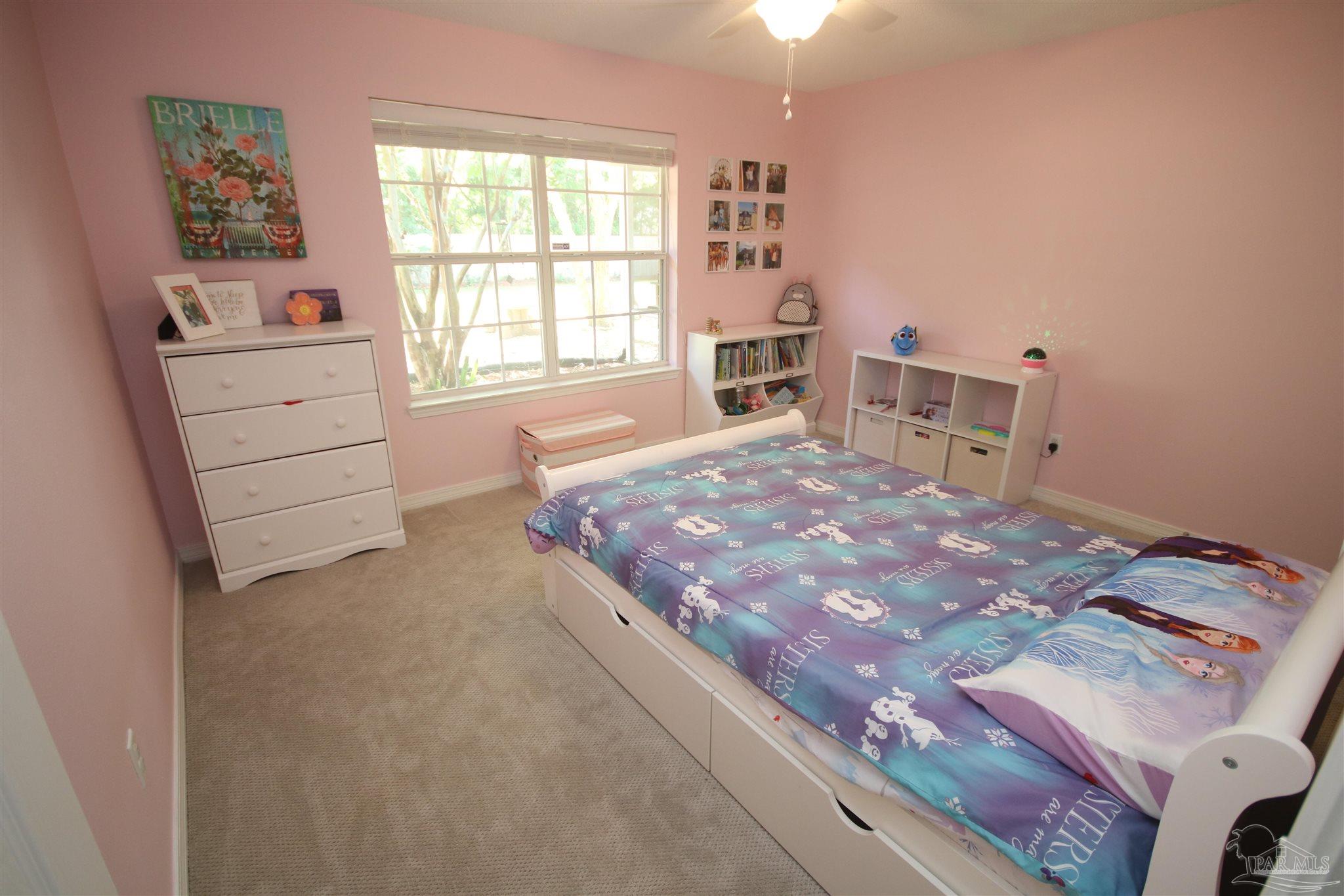 4930 Chads Circle Milton, FL 32571 - Photo 40 of 50 a bedroom with a bed and a window