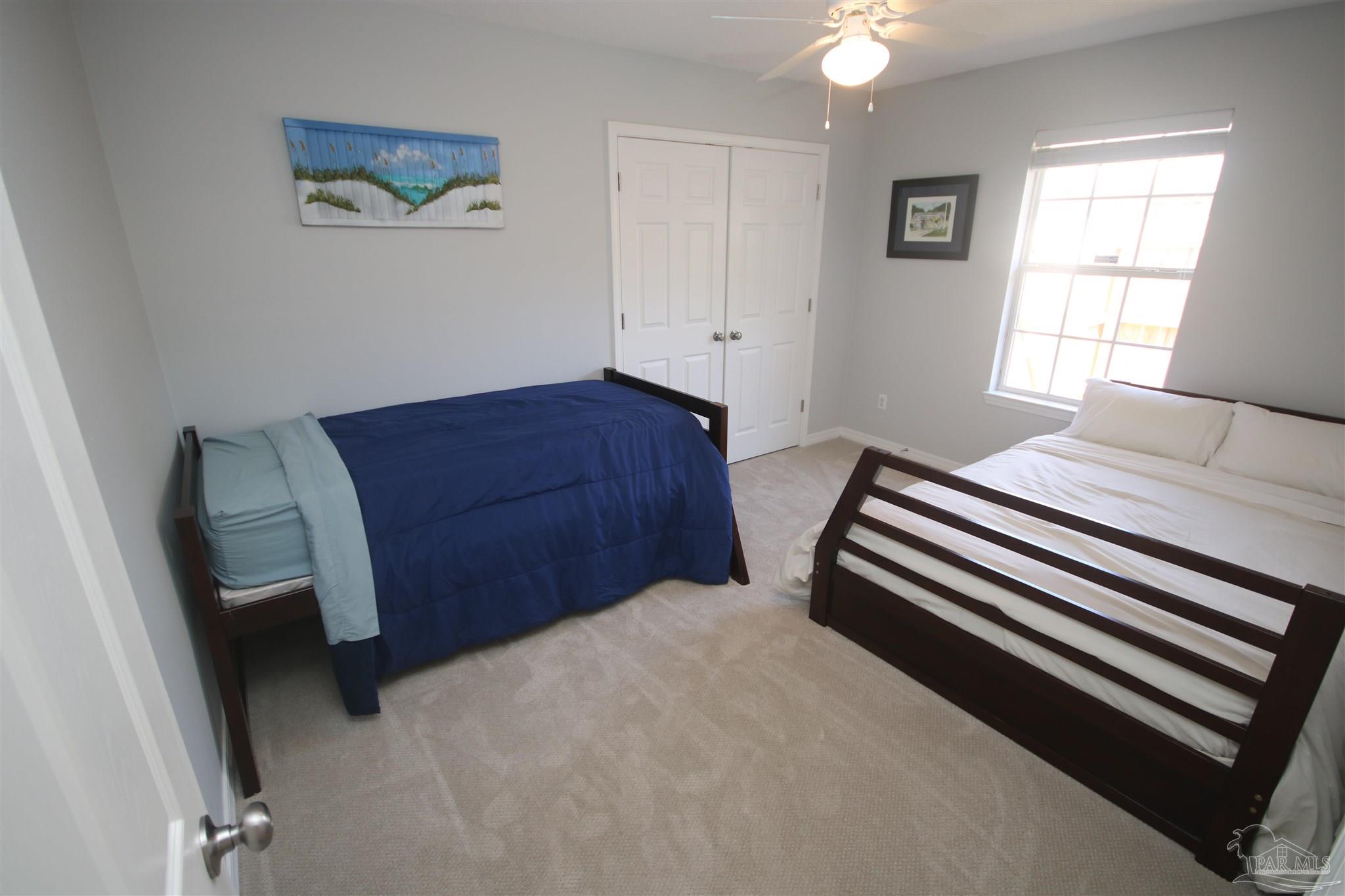 4930 Chads Circle Milton, FL 32571 - Photo 43 of 50 a bedroom with a bed and a window