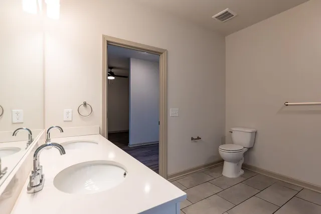 a bathroom with a sink and toilet