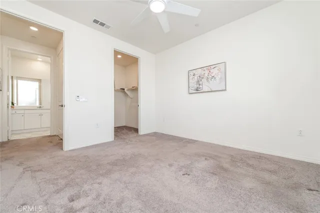 a bathroom with a double vanity sink toilet and shower