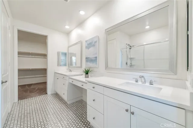a bathroom with a glass shower door