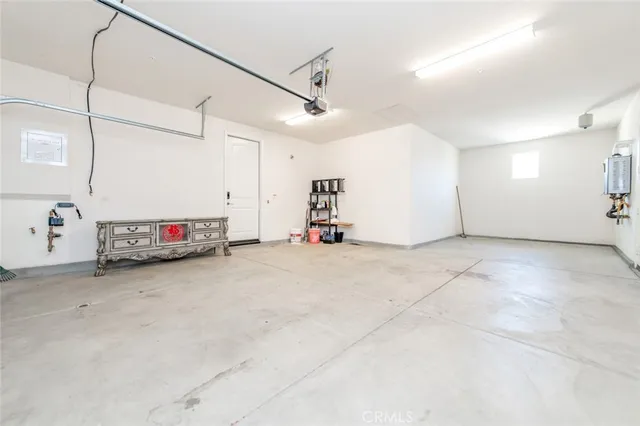 a view of a street with potted plants