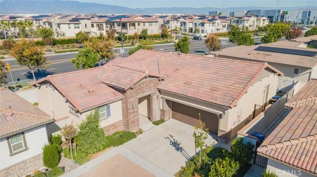 an aerial view of a house with a garden