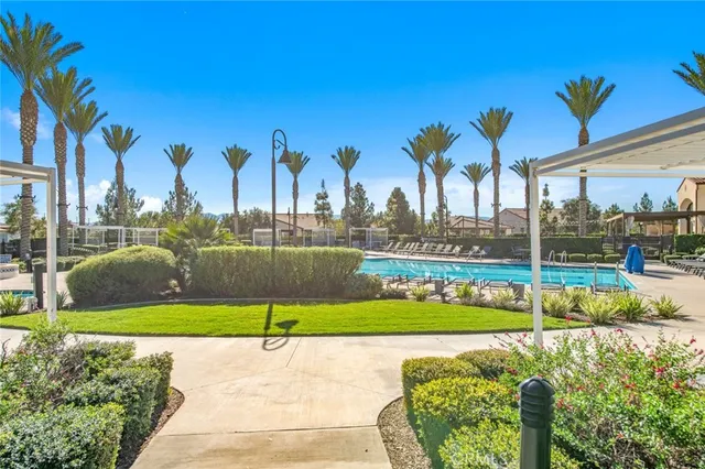an aerial view of residential houses with outdoor space and swimming pool