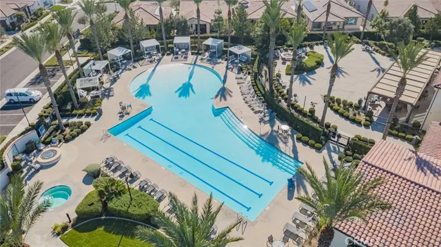 an aerial view of a house with a swimming pool