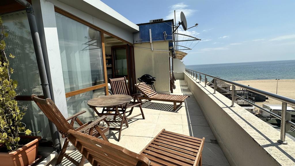 2 Flowers, Unit 51 Absecon, NJ 08205 - Photo 6 of 37 a view of a balcony with chairs and wooden floor