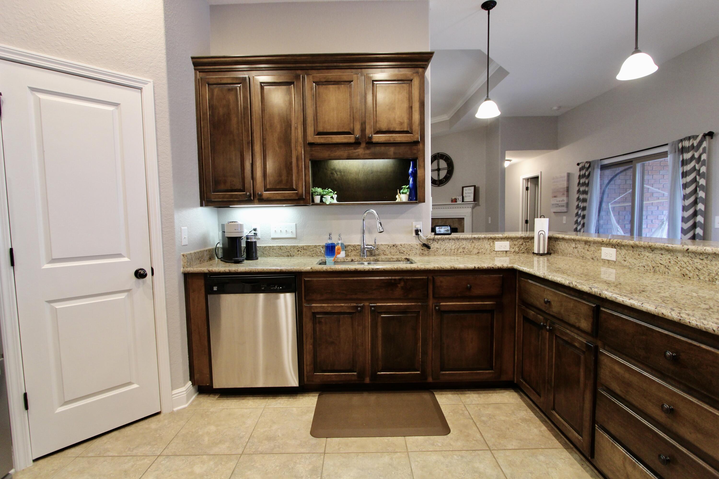 502 Vale Loop Crestview, FL 32536 - Photo 16 of 53 a kitchen with a sink and a microwave