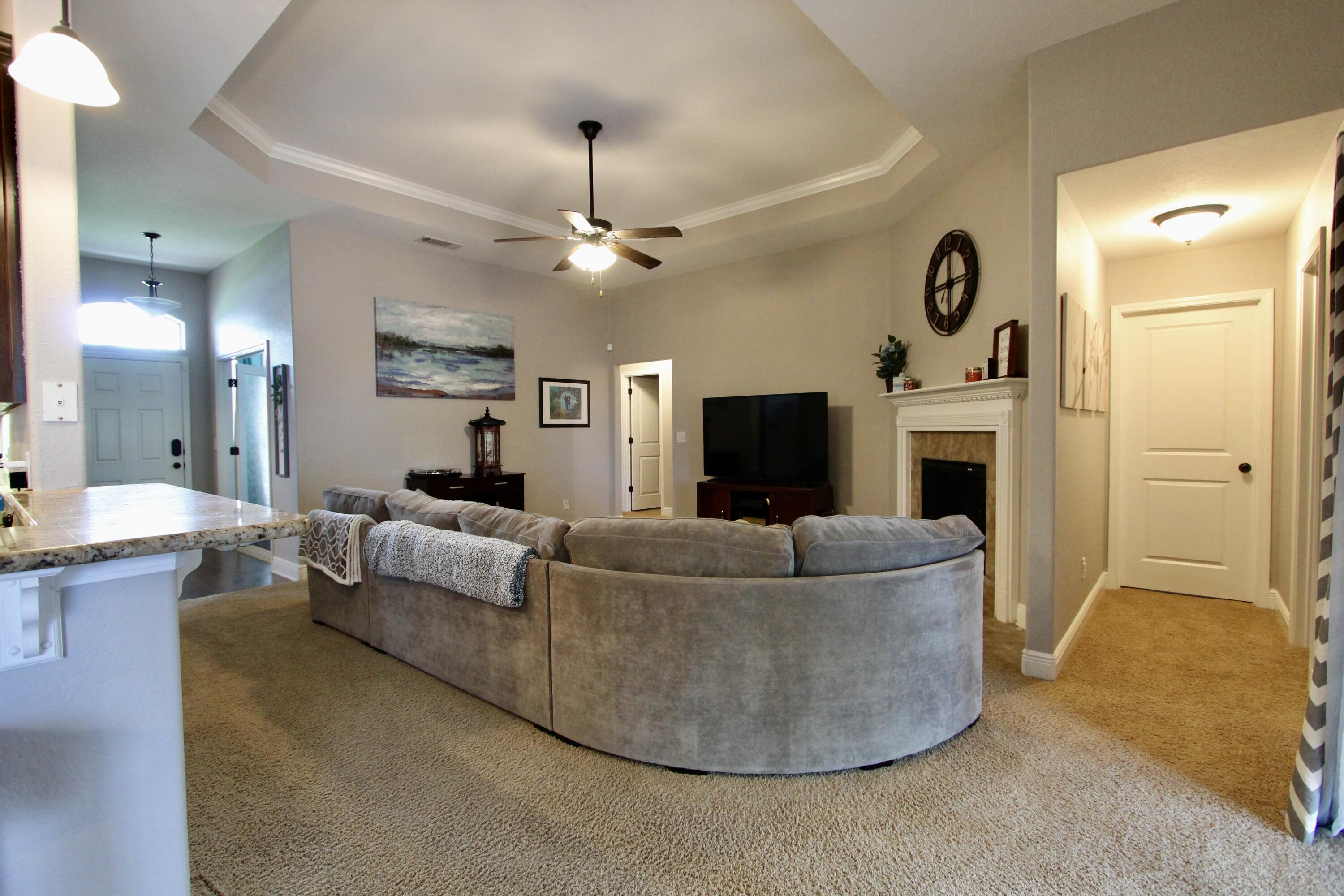 502 Vale Loop Crestview, FL 32536 - Photo 21 of 53 a living room with furniture and a fireplace