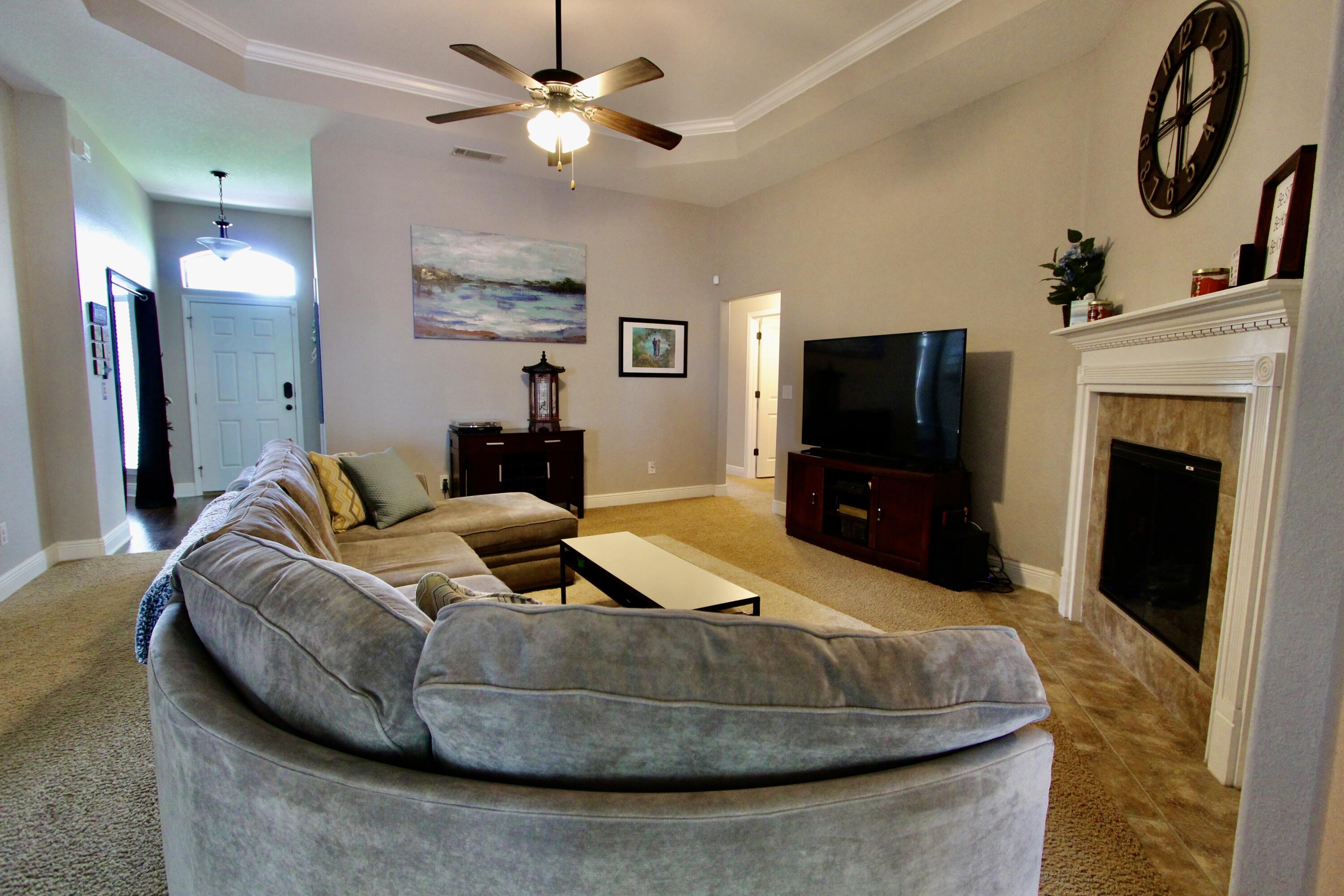 502 Vale Loop Crestview, FL 32536 - Photo 22 of 53 a living room with furniture and a flat screen tv