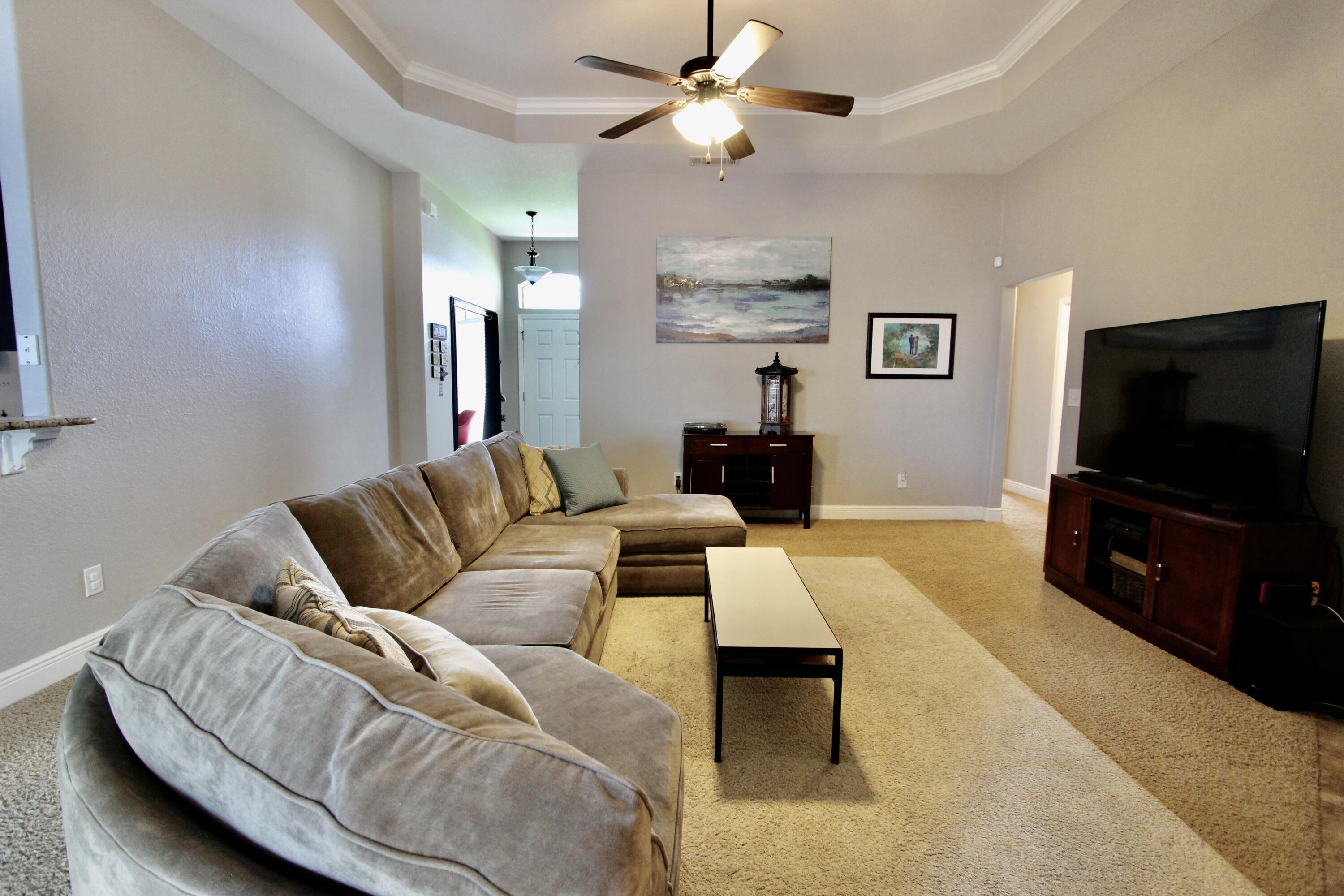 502 Vale Loop Crestview, FL 32536 - Photo 23 of 53 a living room with furniture and a flat screen tv