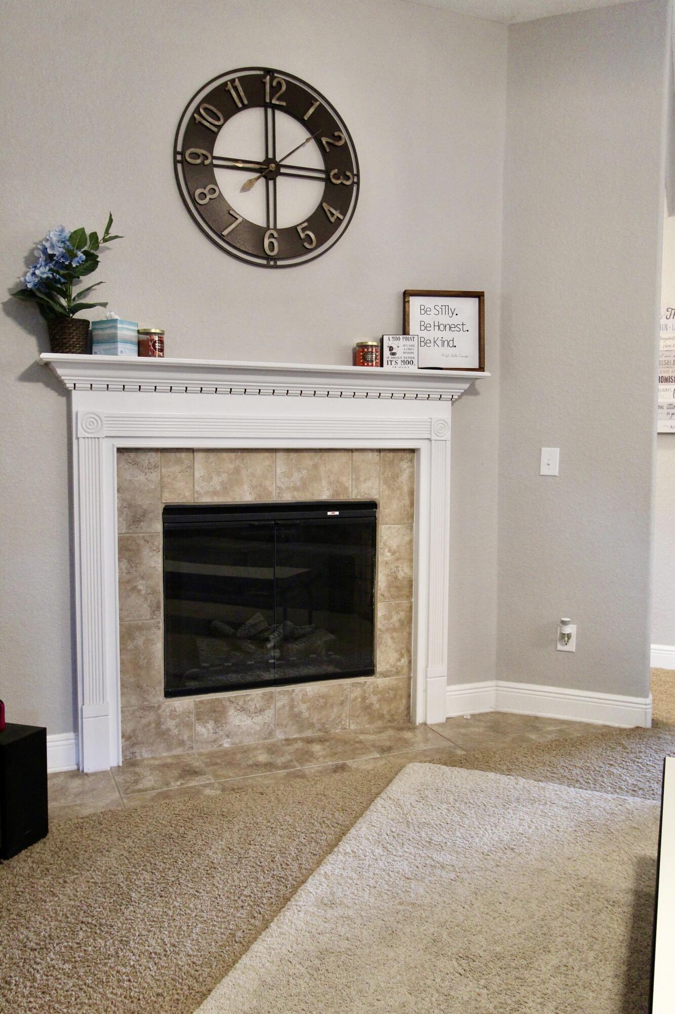 502 Vale Loop Crestview, FL 32536 - Photo 28 of 53 a view of a livingroom with a fireplace and a chandelier fan