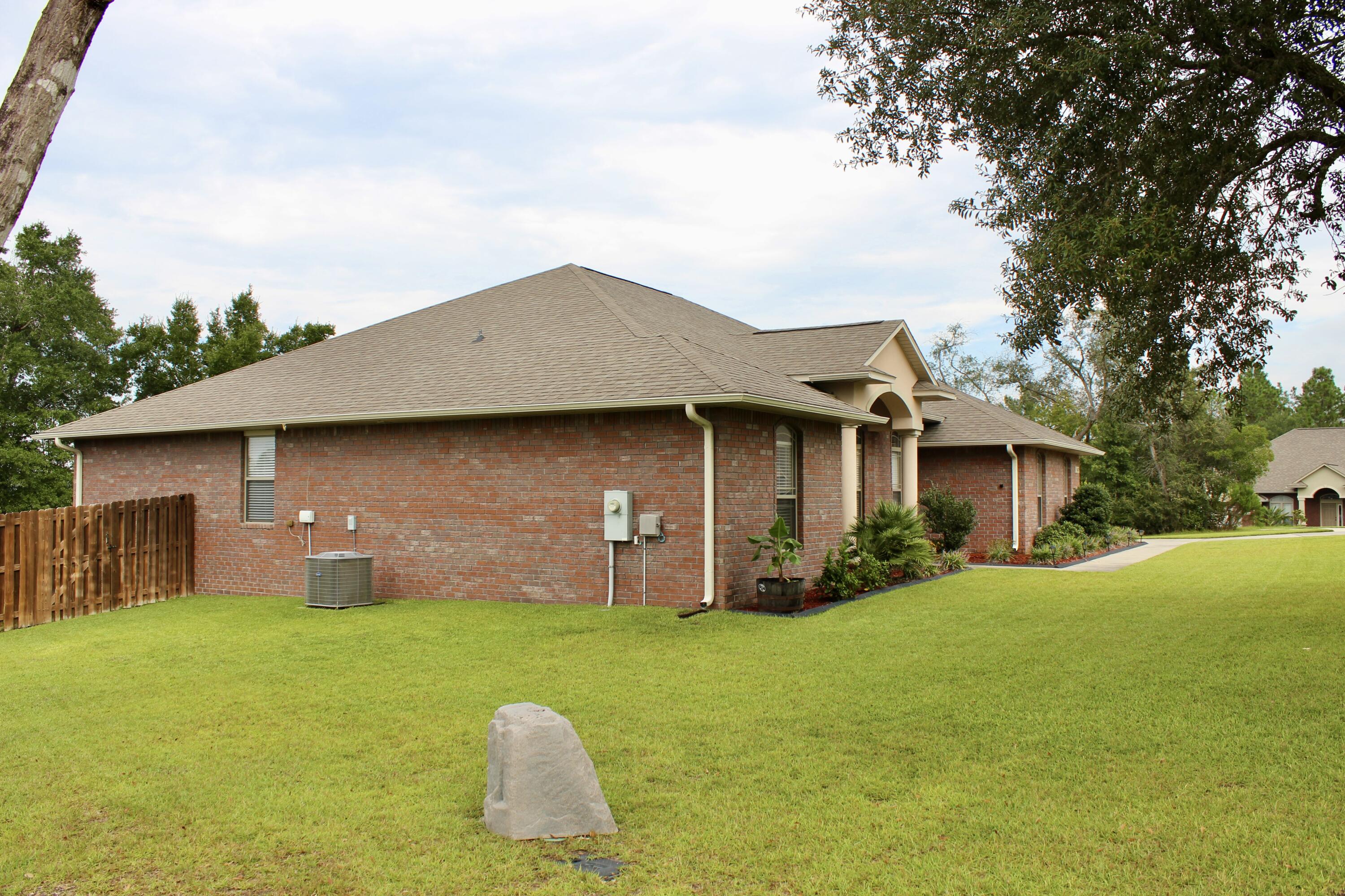 502 Vale Loop Crestview, FL 32536 - Photo 3 of 53 a view of a house with a yard