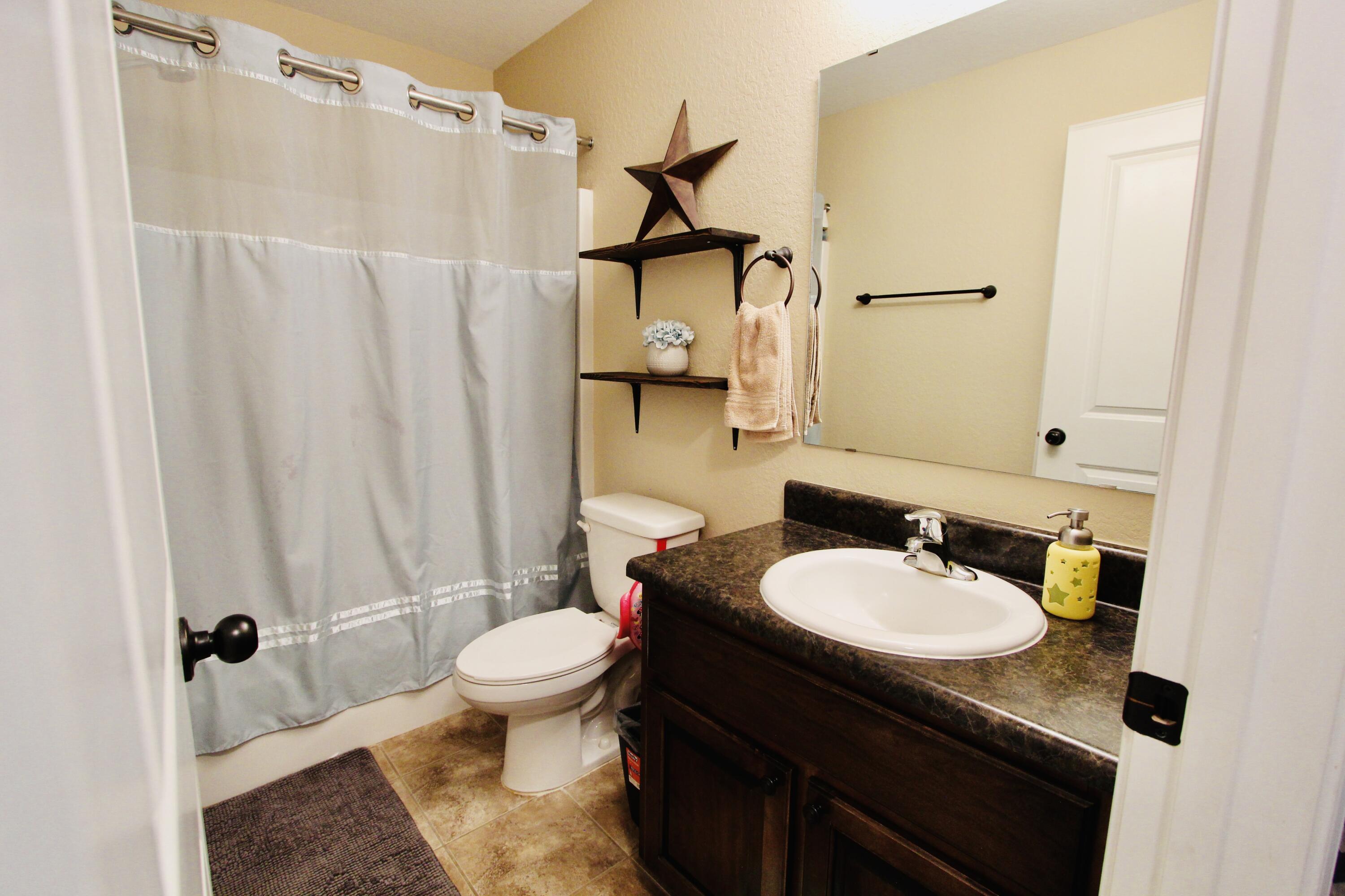502 Vale Loop Crestview, FL 32536 - Photo 33 of 53 a bathroom with a sink toilet and shower