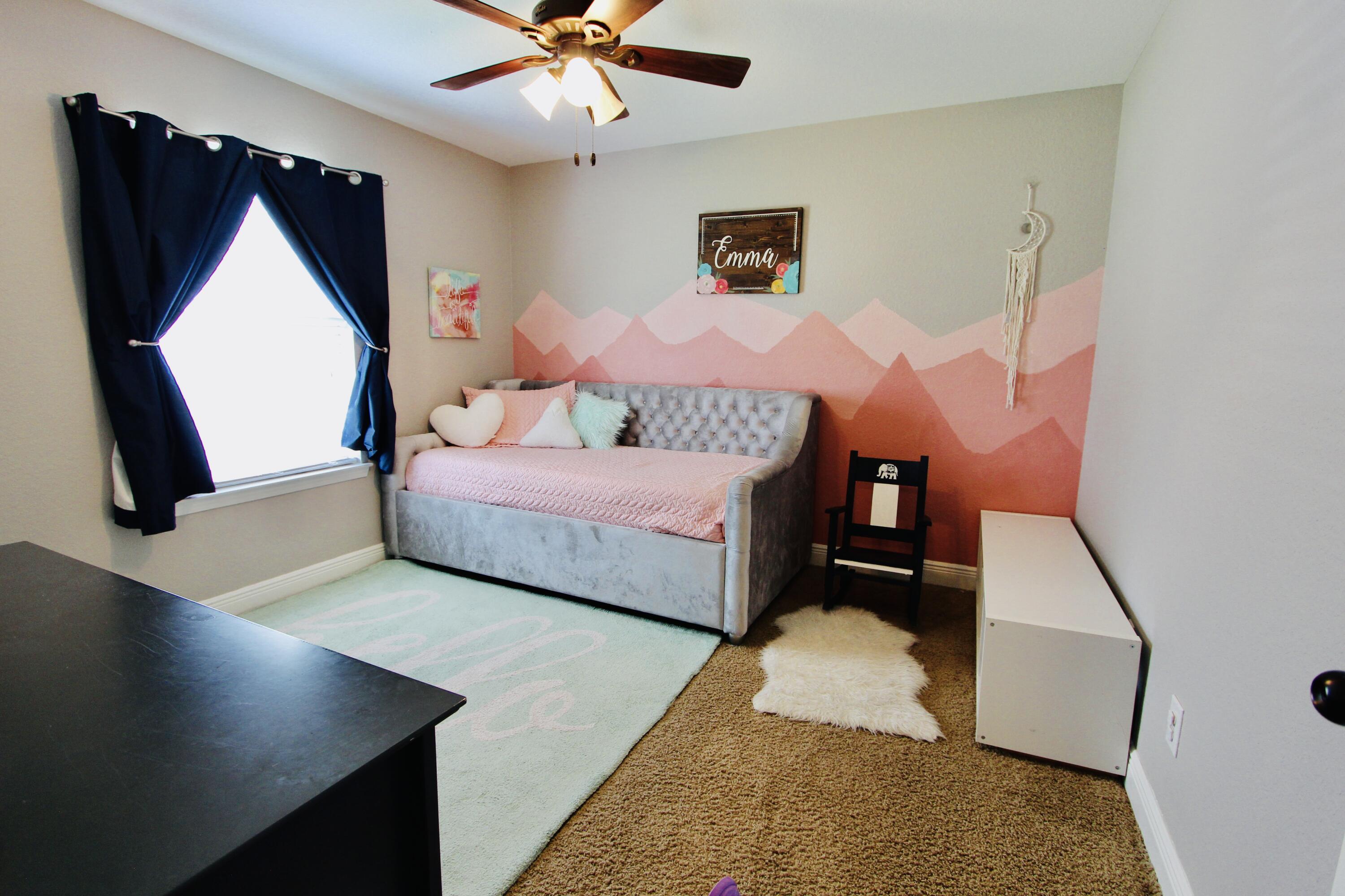 502 Vale Loop Crestview, FL 32536 - Photo 34 of 53 a bedroom with a bed and a flat tv screen on dresser
