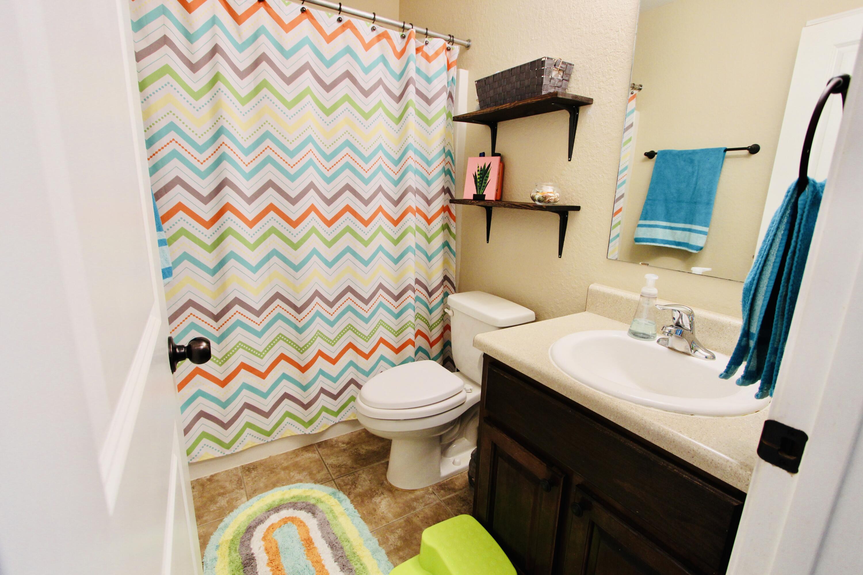502 Vale Loop Crestview, FL 32536 - Photo 35 of 53 a bathroom with a sink and a mirror