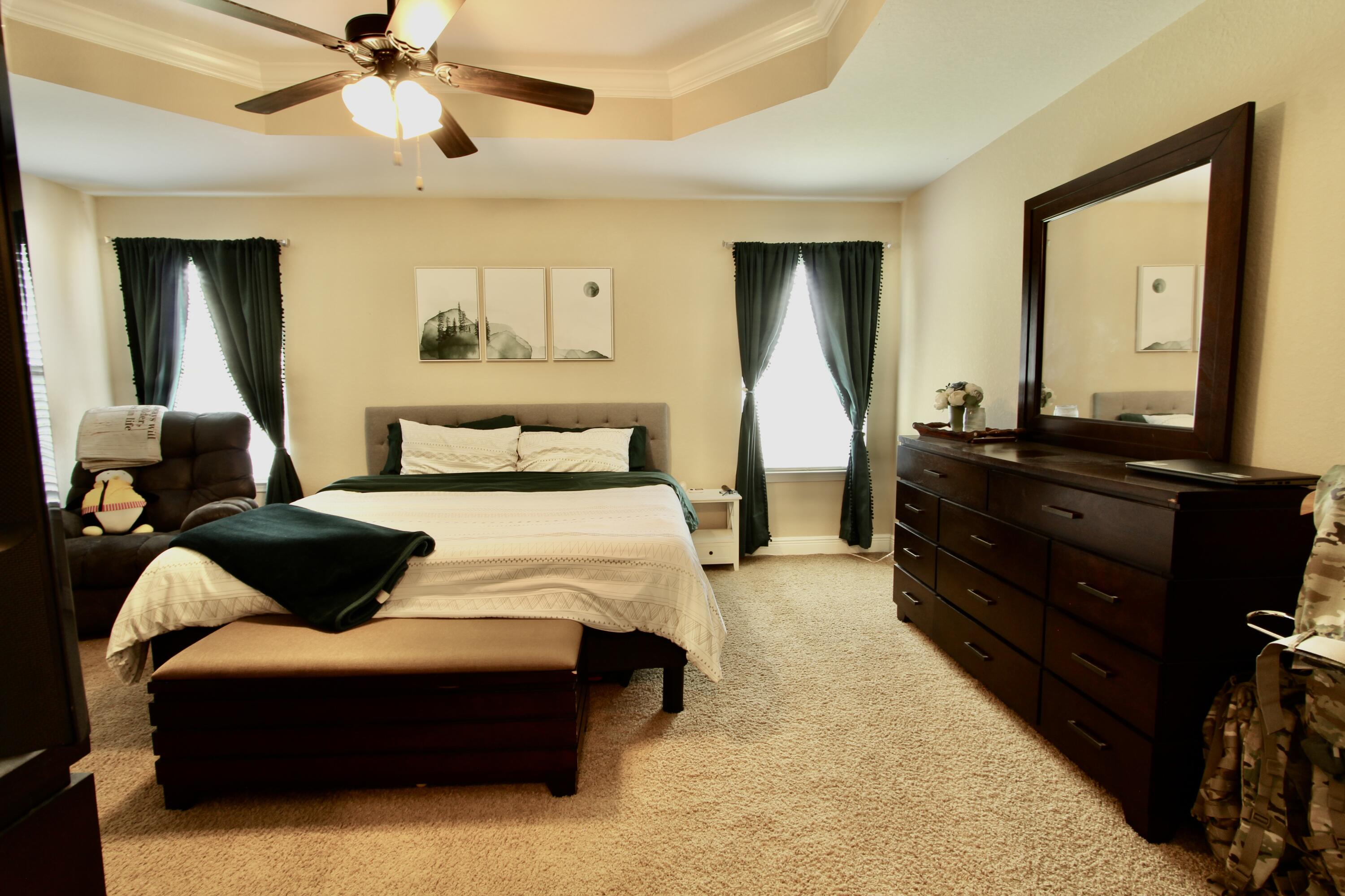 502 Vale Loop Crestview, FL 32536 - Photo 38 of 53 a bedroom with a bed and lamp on dresser