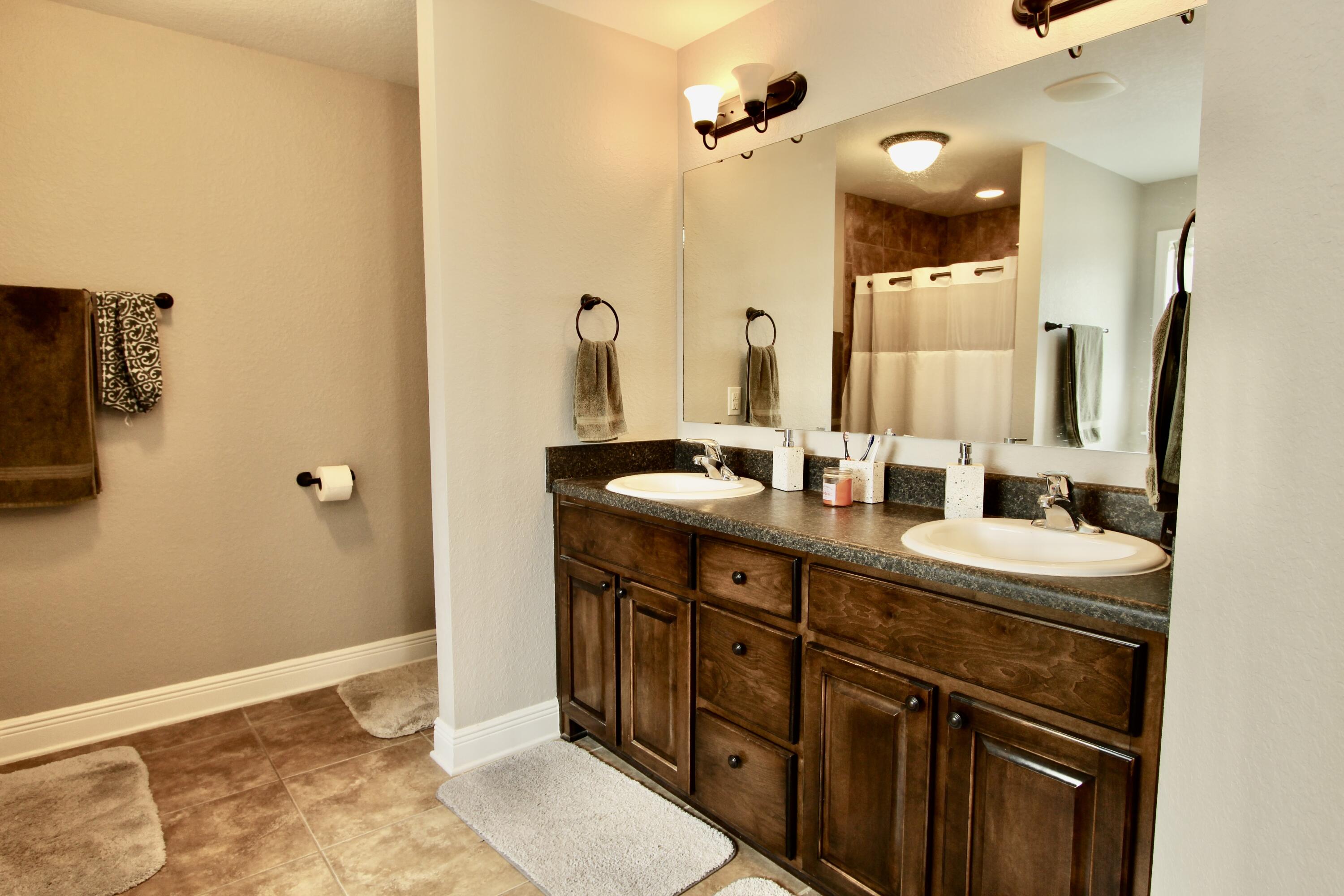 502 Vale Loop Crestview, FL 32536 - Photo 41 of 53 a bathroom with a double vanity sink and a mirror