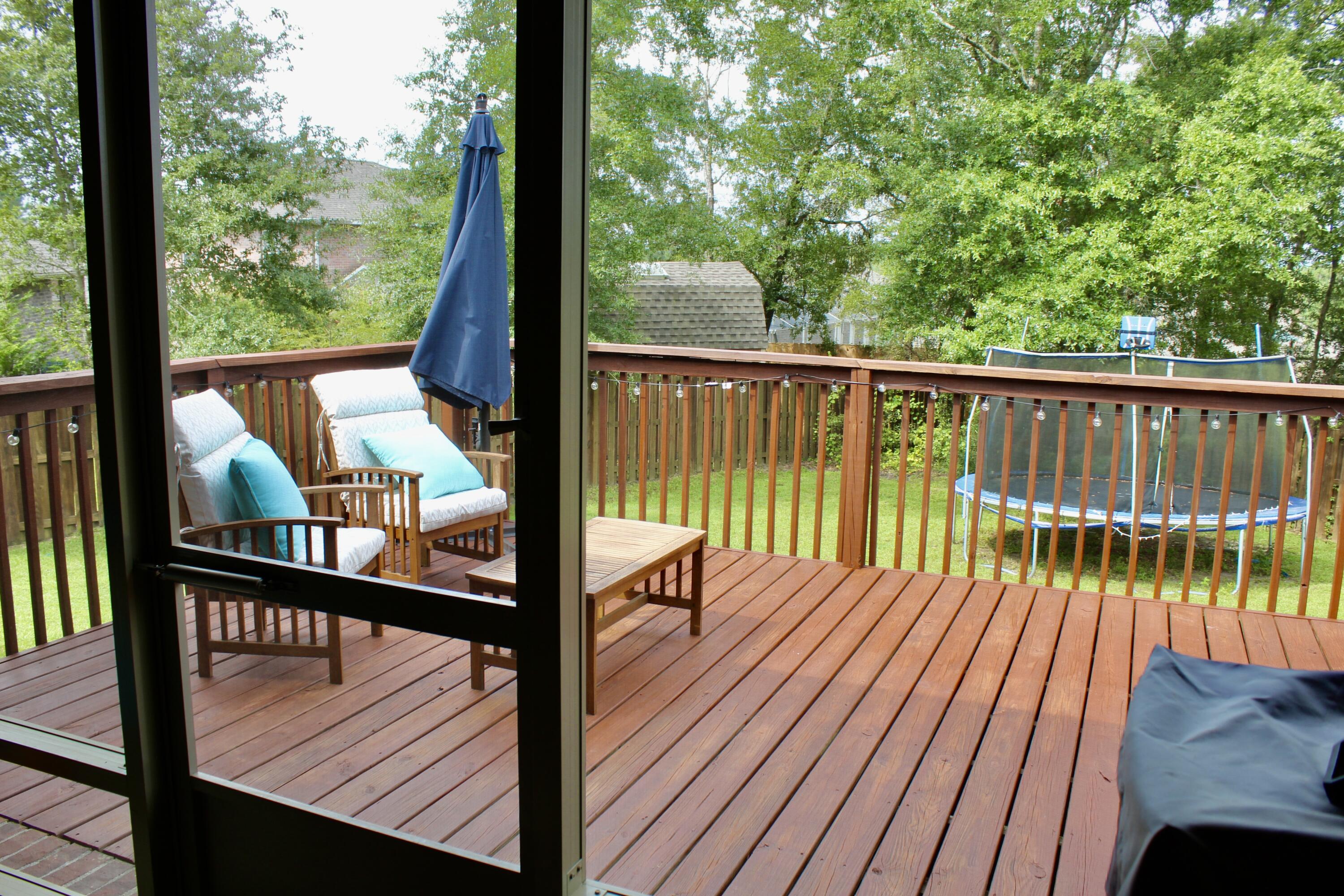502 Vale Loop Crestview, FL 32536 - Photo 45 of 53 a view of balcony with wooden floor and fence